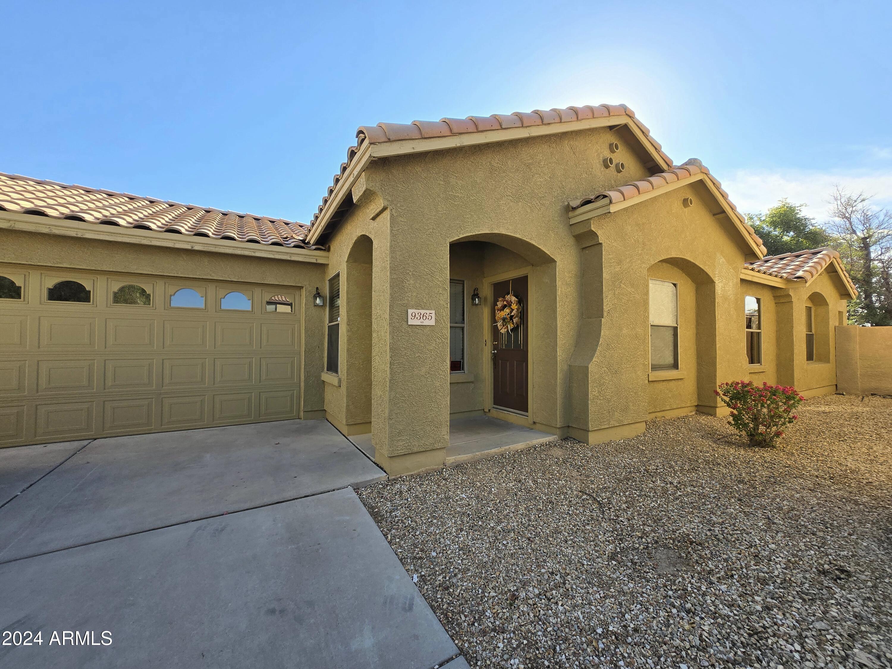9365 West Eaton Road Phoenix, AZ 85037 - Photo 3 of 30 a view of a house with a outdoor space