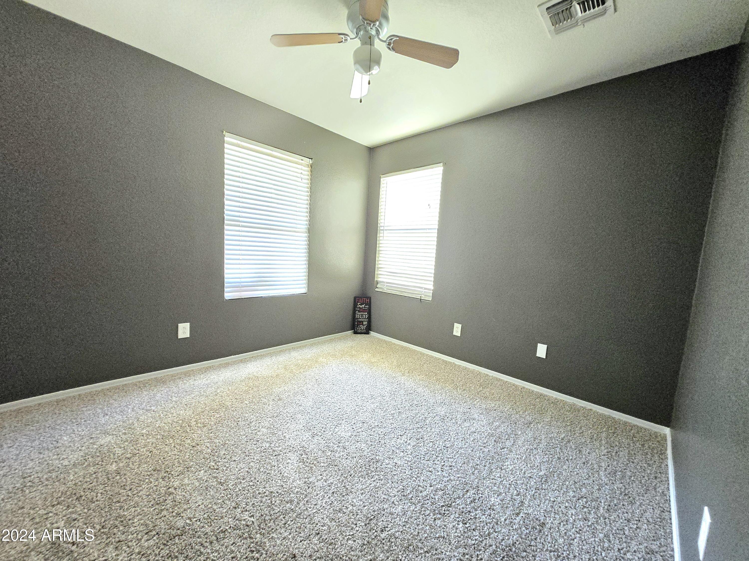 9365 West Eaton Road Phoenix, AZ 85037 - Photo 9 of 30 a view of an empty room with a window