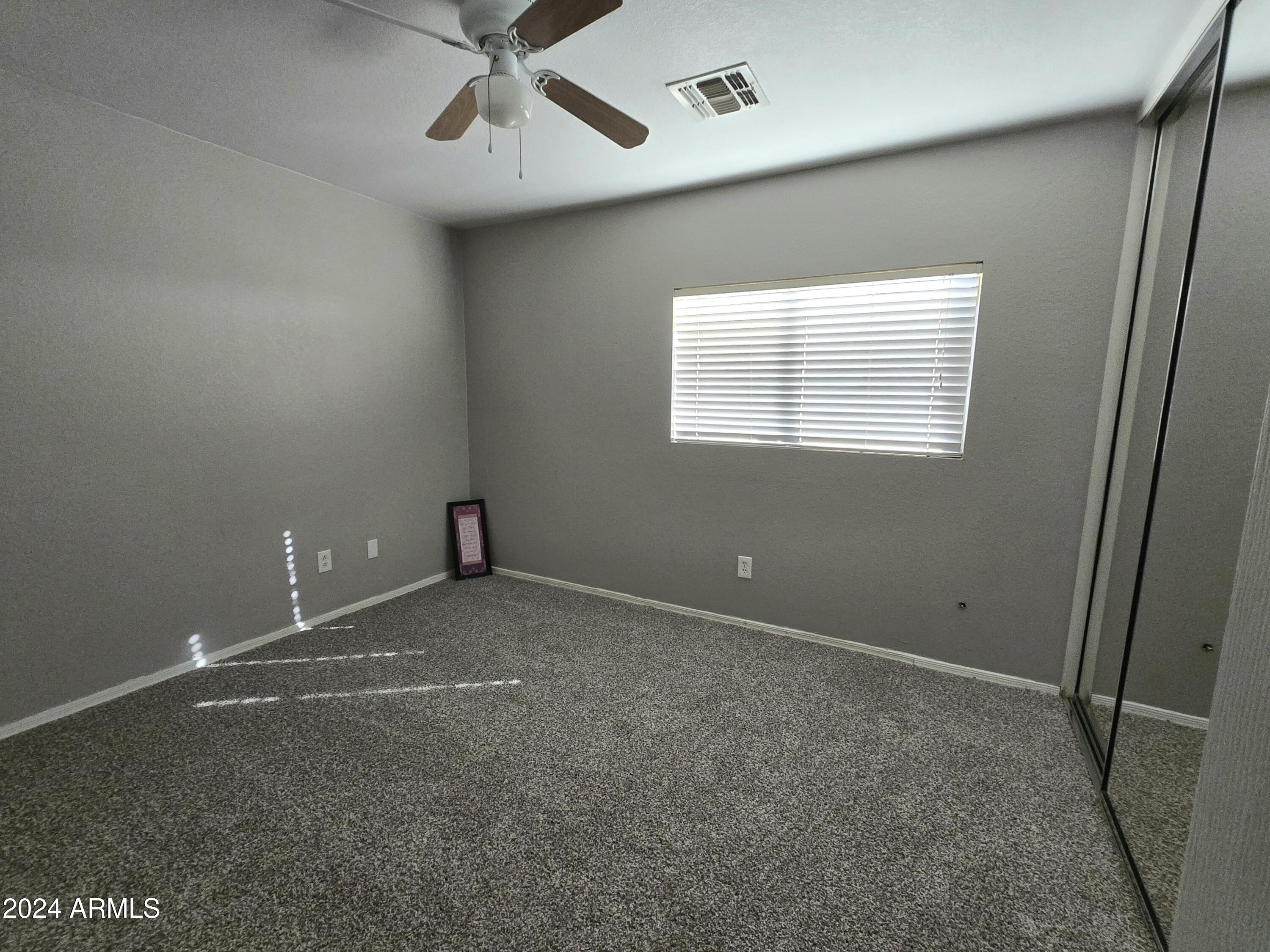 9365 West Eaton Road Phoenix, AZ 85037 - Photo 10 of 30 a view of an empty room with a window