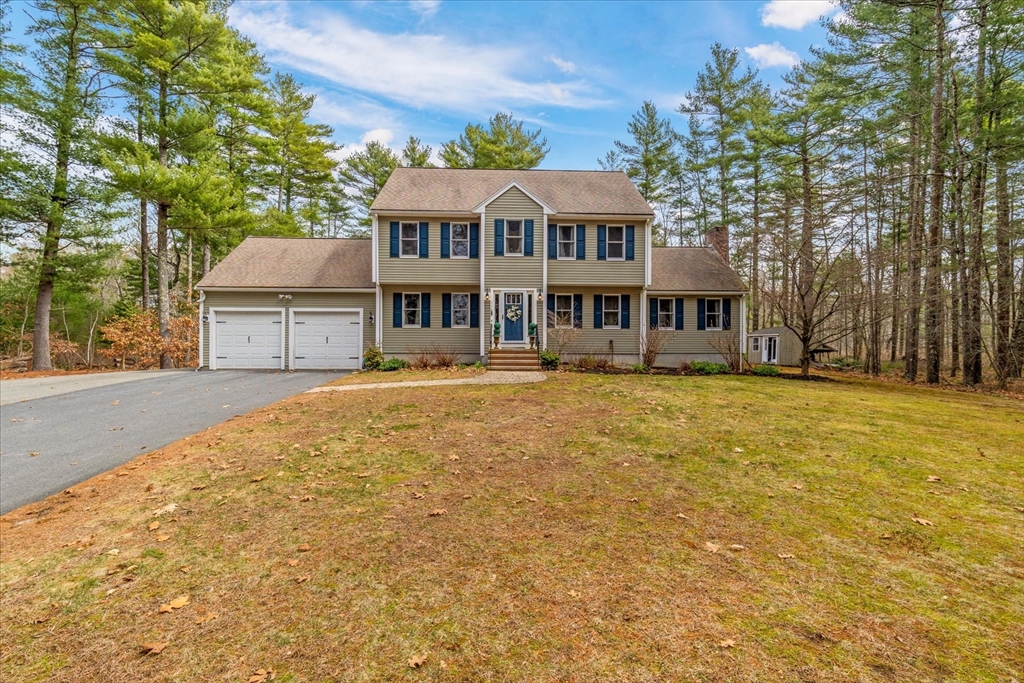 116 Meadow Street Carver, MA 02330 - Photo 1 of 42 a front view of a building with a yard