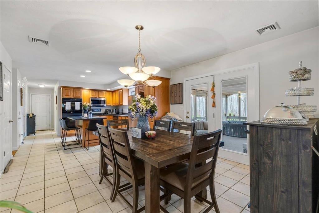116 Meadow Street Carver, MA 02330 - Photo 11 of 42 a view of a dining room with furniture