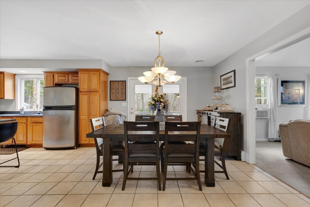 116 Meadow Street Carver, MA 02330 - Photo 12 of 42 a view of a dining room with furniture