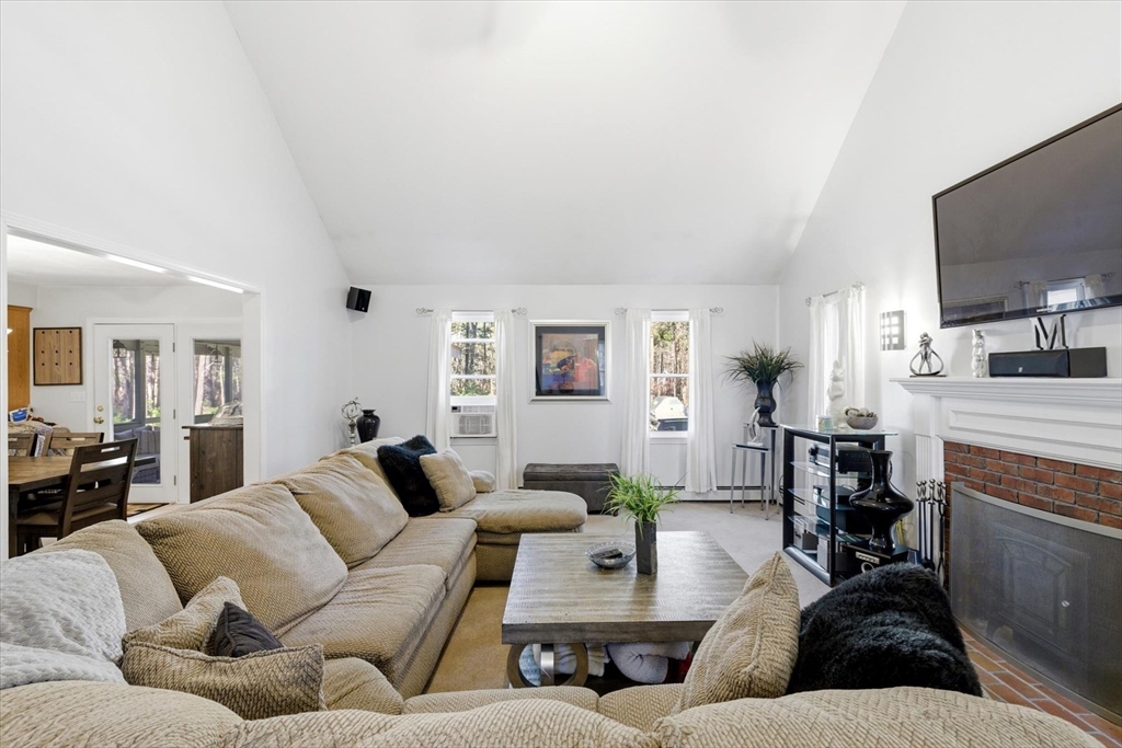 116 Meadow Street Carver, MA 02330 - Photo 15 of 42 a living room with furniture and a flat screen tv