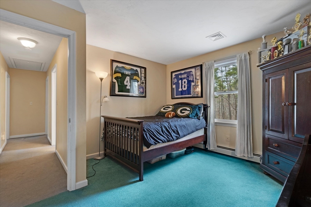 116 Meadow Street Carver, MA 02330 - Photo 23 of 42 a bedroom with a bed and a window
