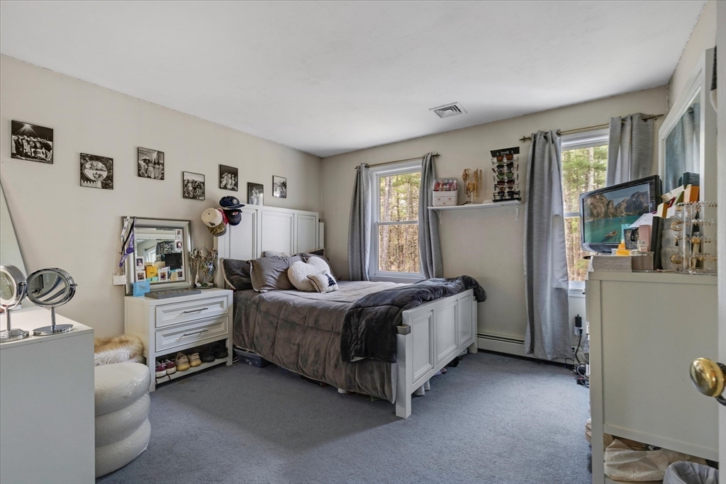 116 Meadow Street Carver, MA 02330 - Photo 24 of 42 a room with a bed and a view of kitchen