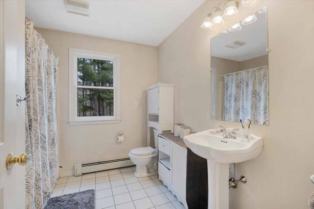 116 Meadow Street Carver, MA 02330 - Photo 26 of 42 a bathroom with a sink toilet and shower