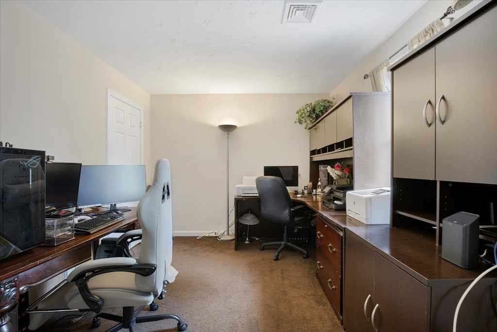 116 Meadow Street Carver, MA 02330 - Photo 27 of 42 a view of a workspace with furniture and a window
