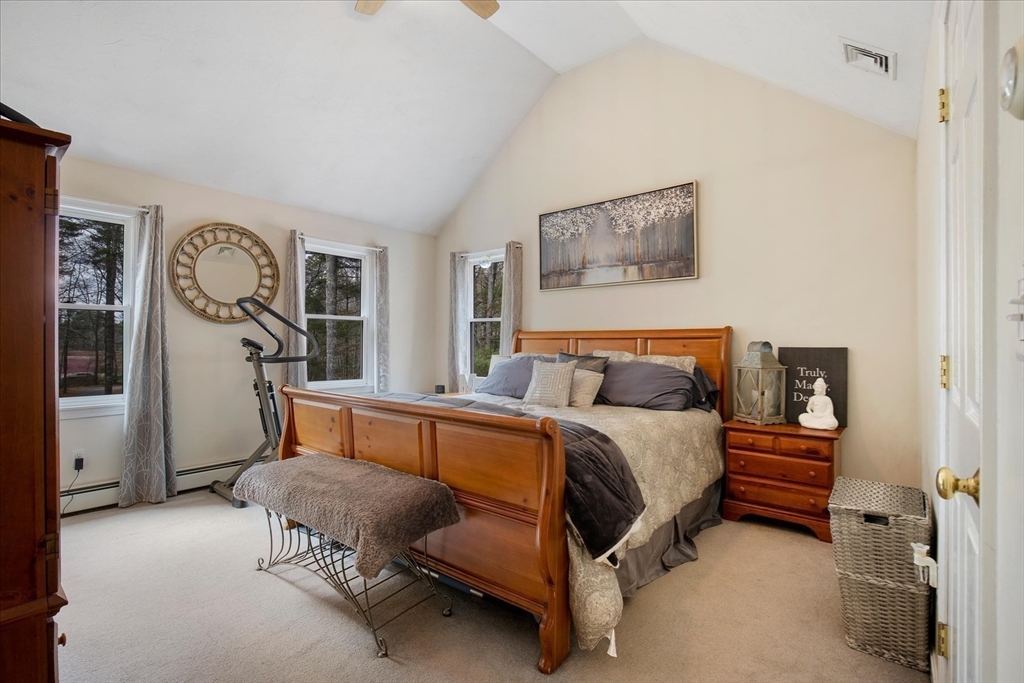 116 Meadow Street Carver, MA 02330 - Photo 29 of 42 a bedroom with a bed and a cabinets