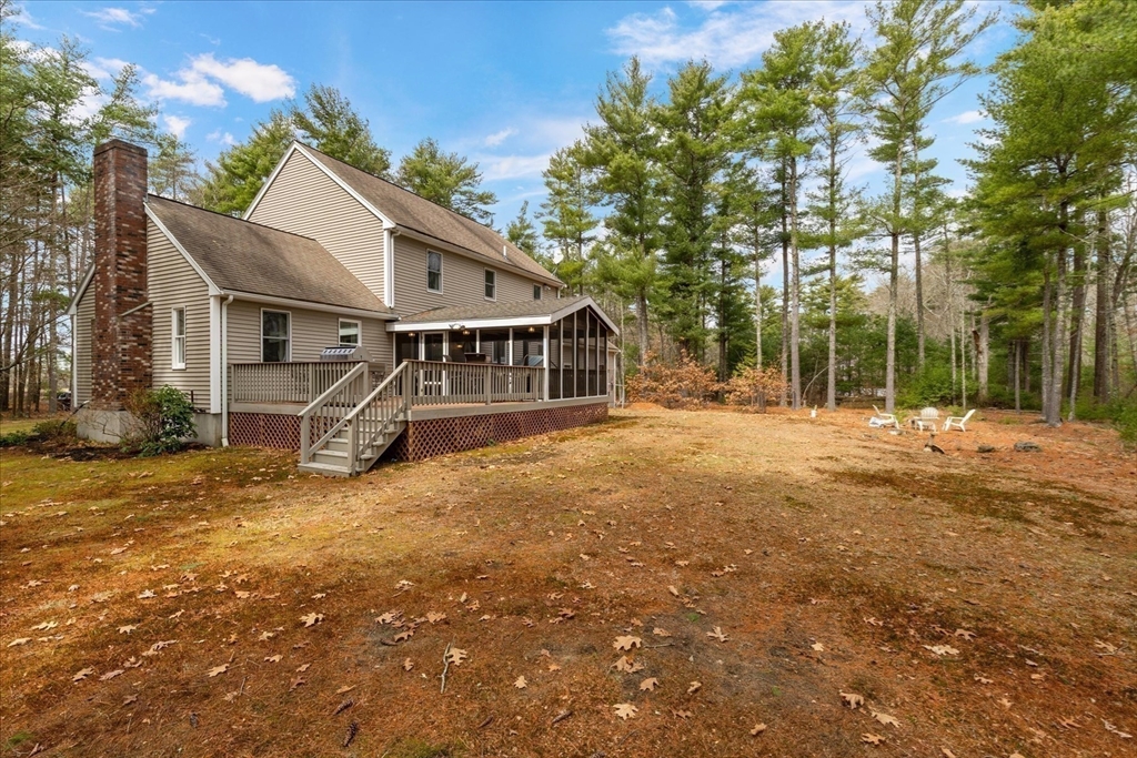 116 Meadow Street Carver, MA 02330 - Photo 32 of 42 a view of a house with a yard