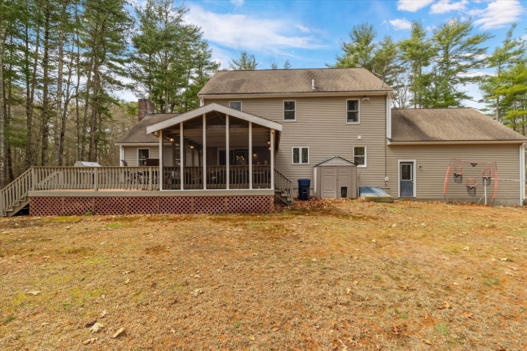 116 Meadow Street Carver, MA 02330 - Photo 33 of 42 a view of a house with a yard