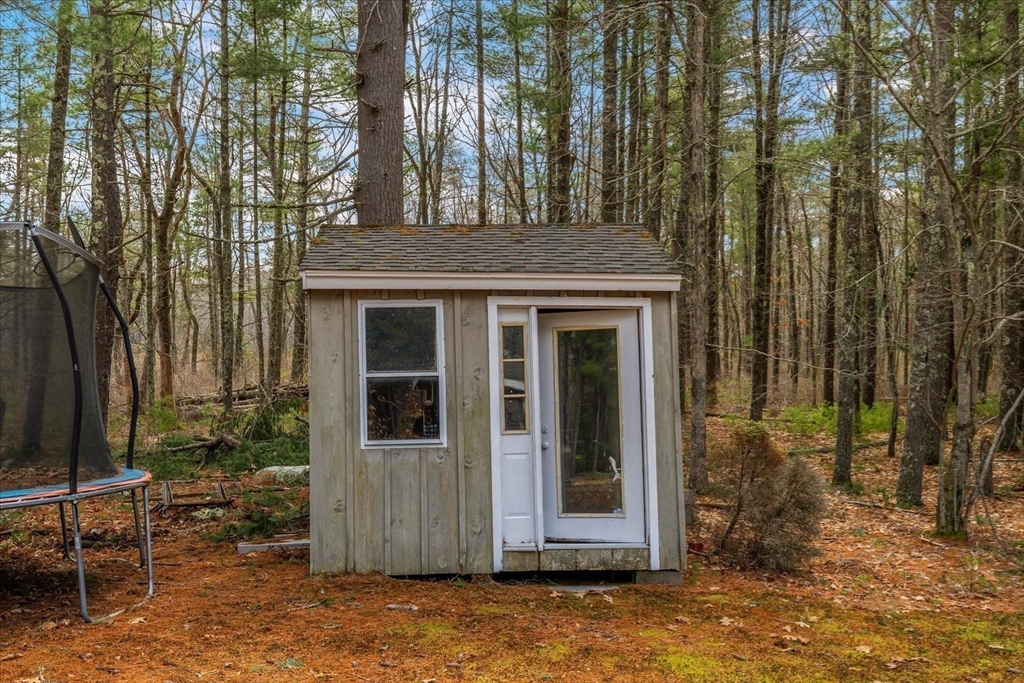 116 Meadow Street Carver, MA 02330 - Photo 36 of 42 front view of a house with a tree