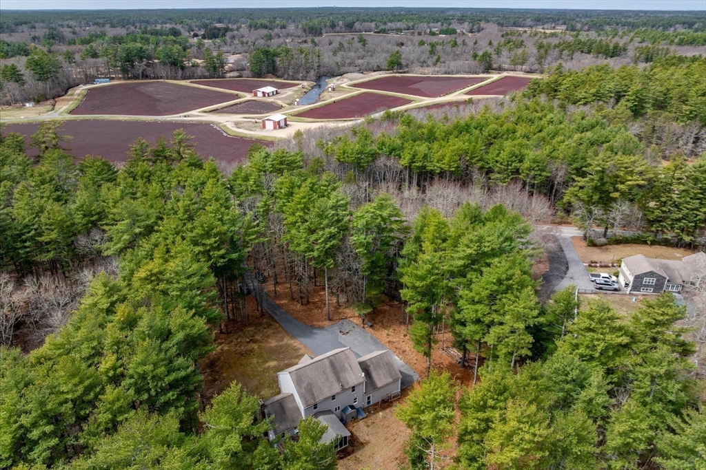 116 Meadow Street Carver, MA 02330 - Photo 40 of 42 an aerial view of a house with outdoor space and lake view