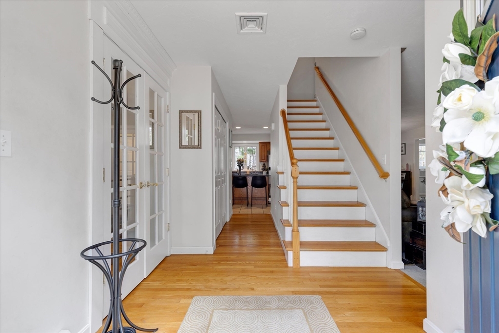 116 Meadow Street Carver, MA 02330 - Photo 4 of 42 a view of an entryway with wooden floor