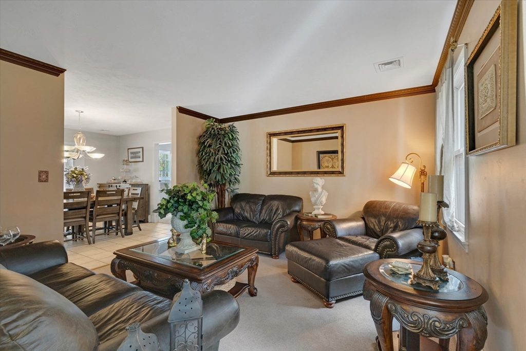 116 Meadow Street Carver, MA 02330 - Photo 5 of 42 a living room with furniture and wooden floor