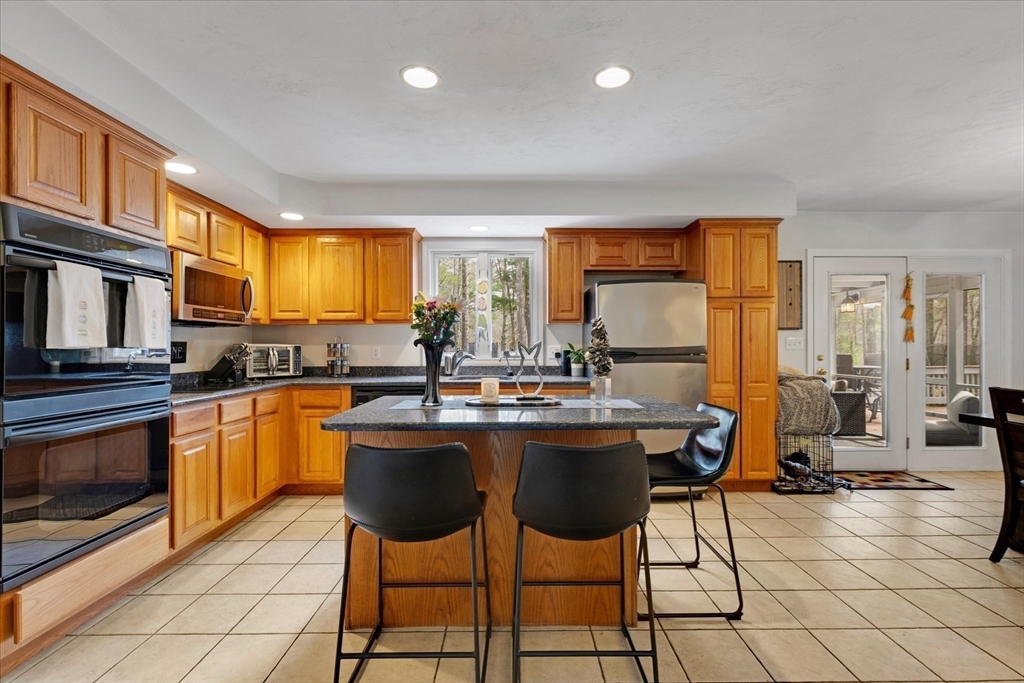 116 Meadow Street Carver, MA 02330 - Photo 7 of 42 a kitchen with a sink cabinets and window