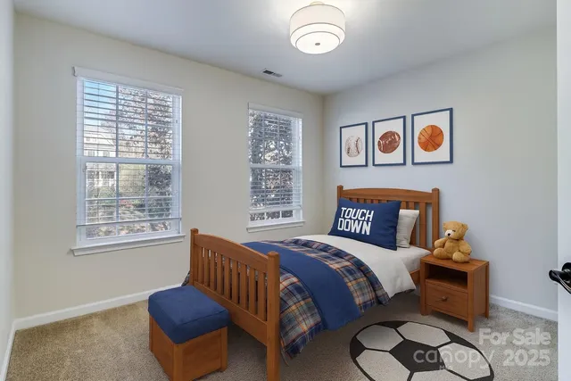 a bedroom with furniture and a window