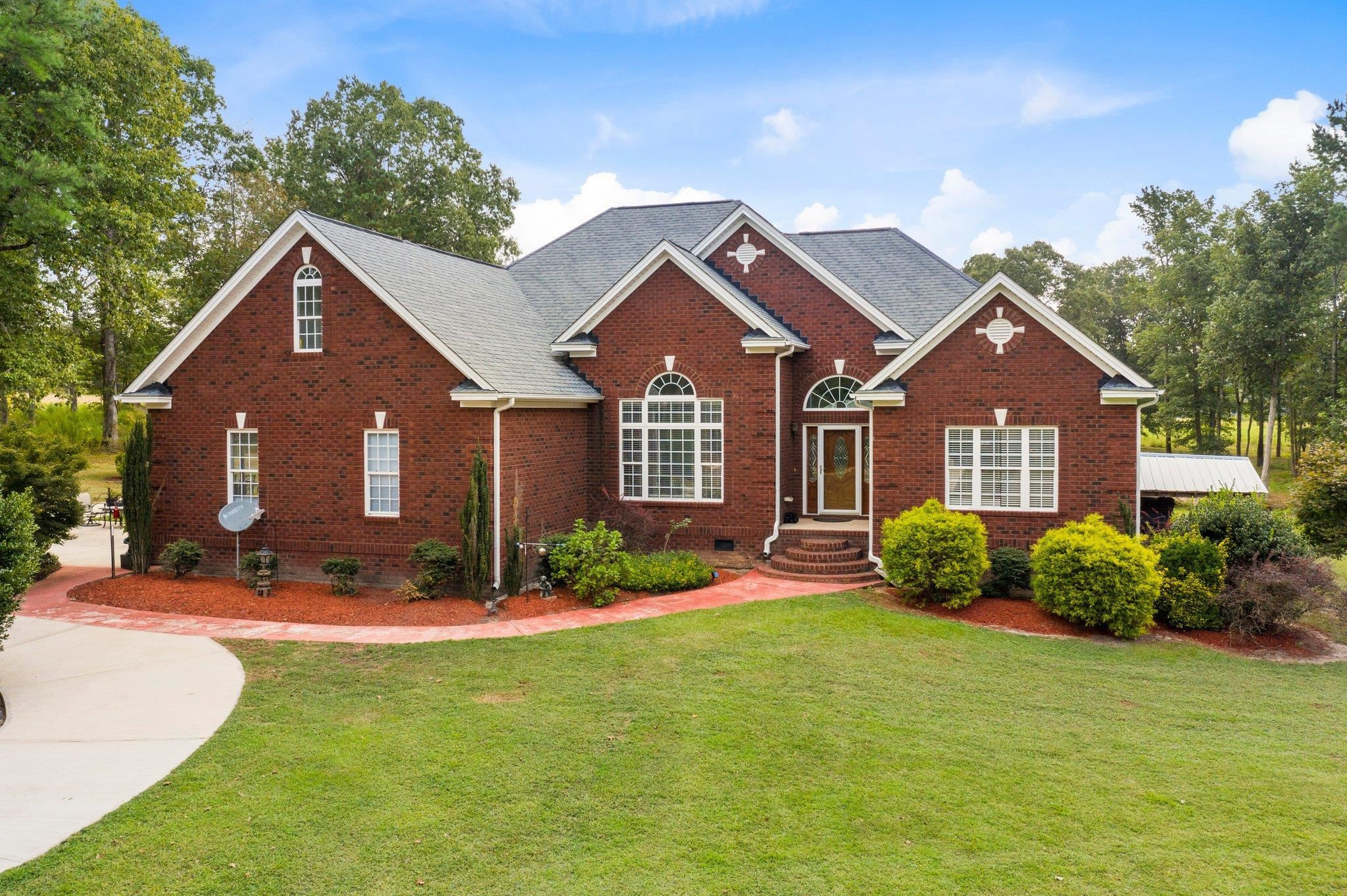 Welcome to 525 Eatmon Road. All brick one story home seated on 3 acres of land with pond in the front. Exterior Front