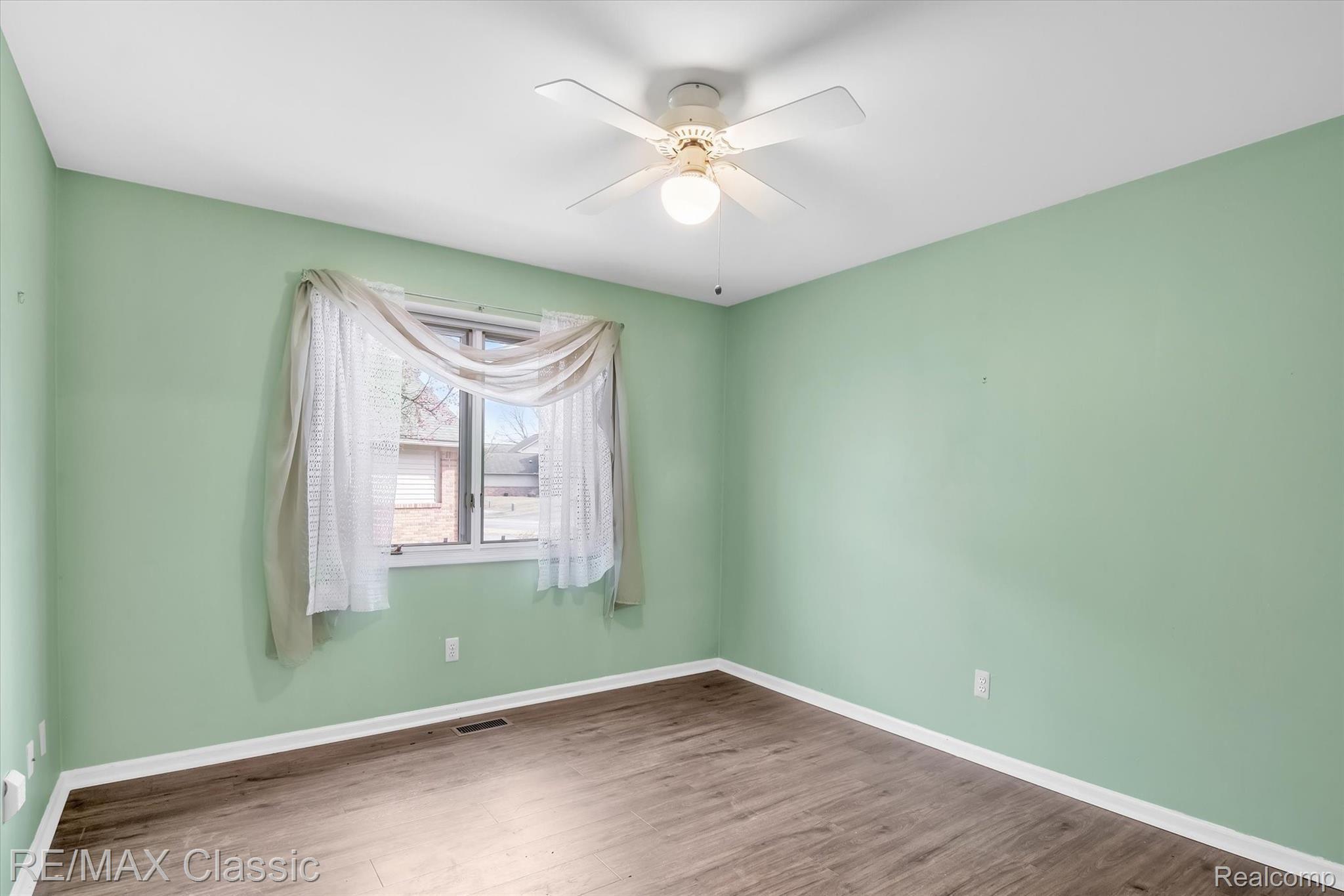3036 Rivers Edge Drive Wayne, MI 48184 - Photo 21 of 33 Second Bedroom with newer wood like laminate flooring.
