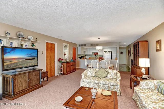 a kitchen with stainless steel appliances granite countertop a refrigerator and a stove