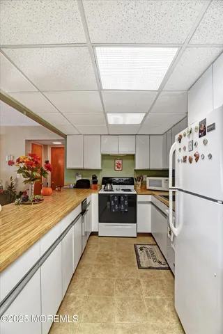 a view of a kitchen and dining room