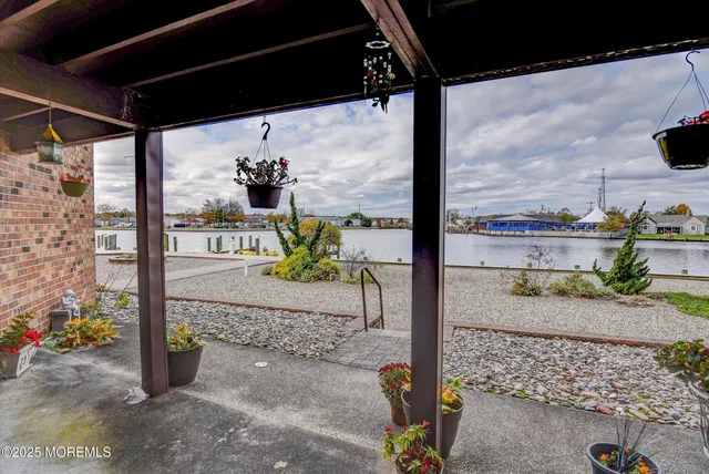 a view of a dry yard with wooden fence