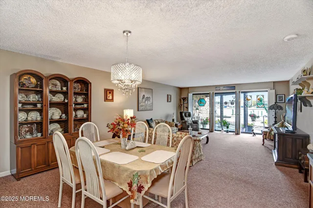 a living room with furniture large window and a flat screen tv