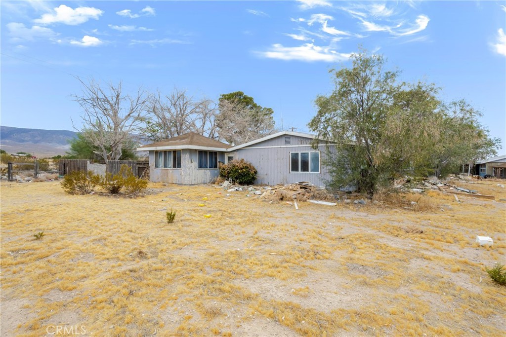 38484 Foothill Road Lucerne Valley, CA 92356 - Photo 24 of 45 a front view of house with yard and trees in the background