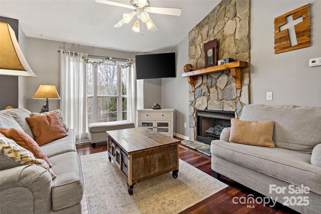 2691 Laurel Point Drive Nebo, NC 28761 - Photo 12 of 44 a living room with furniture and a flat screen tv