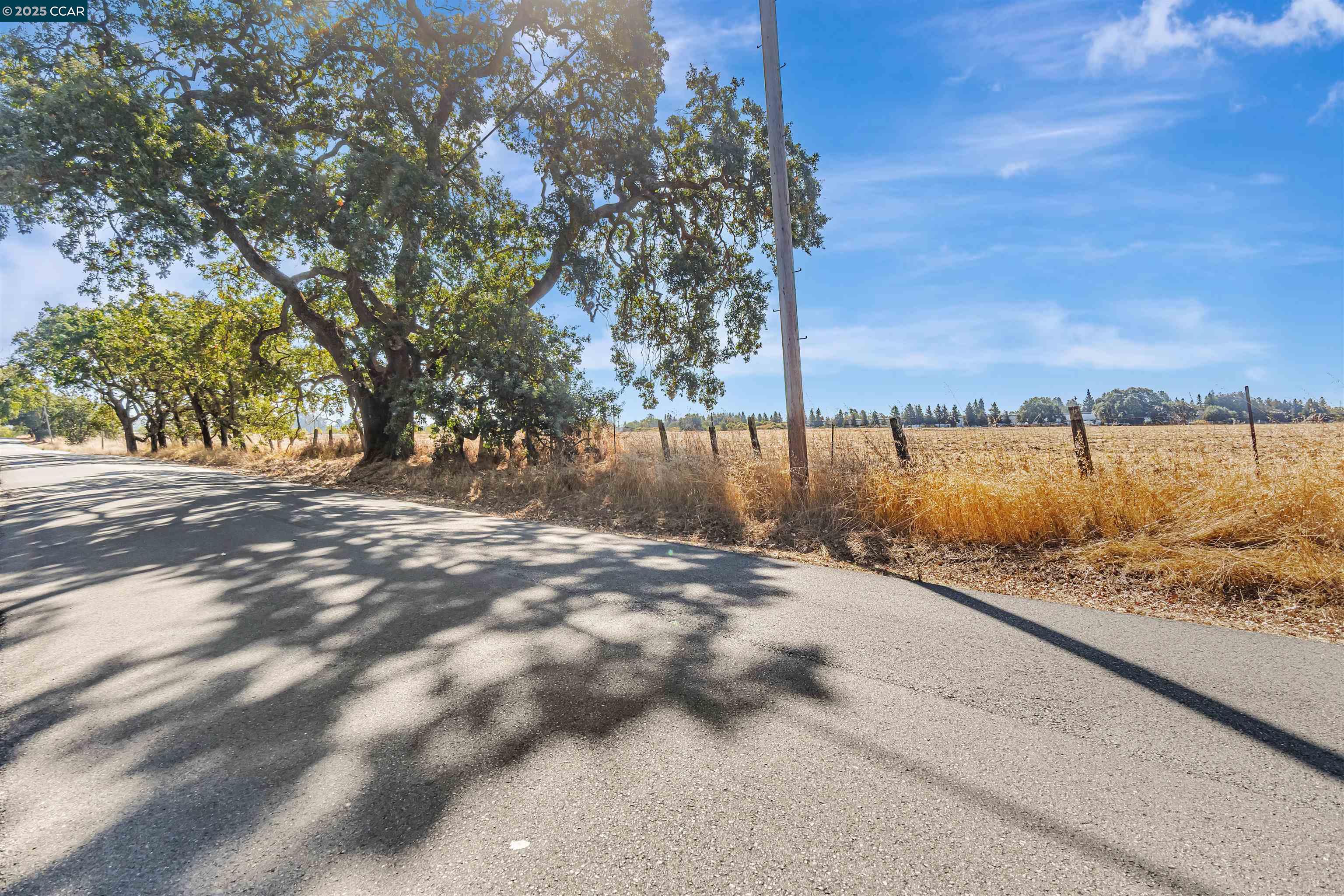 21200 Silva Road Sonoma, CA 95476 - Photo 26 of 41 a view of a road with a yard