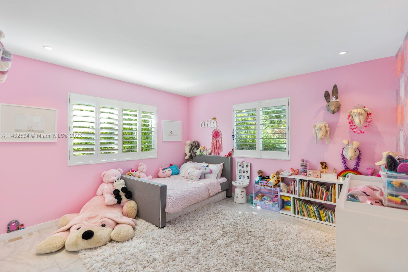 4741 Alton Road Miami Beach, FL 33140 - Photo 11 of 27 a bedroom with furniture and a window