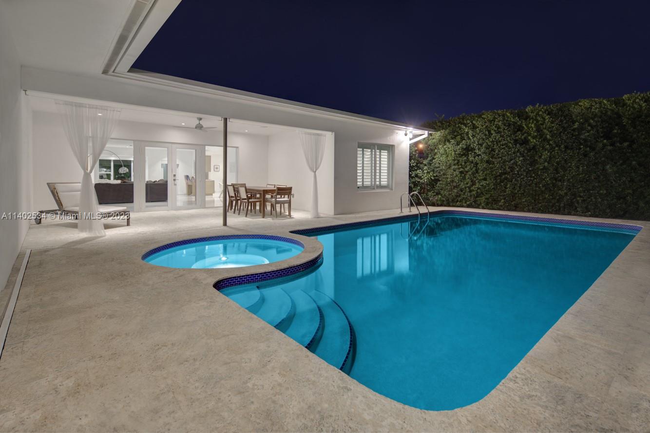 4741 Alton Road Miami Beach, FL 33140 - Photo 21 of 27 a view of a living room and kitchen