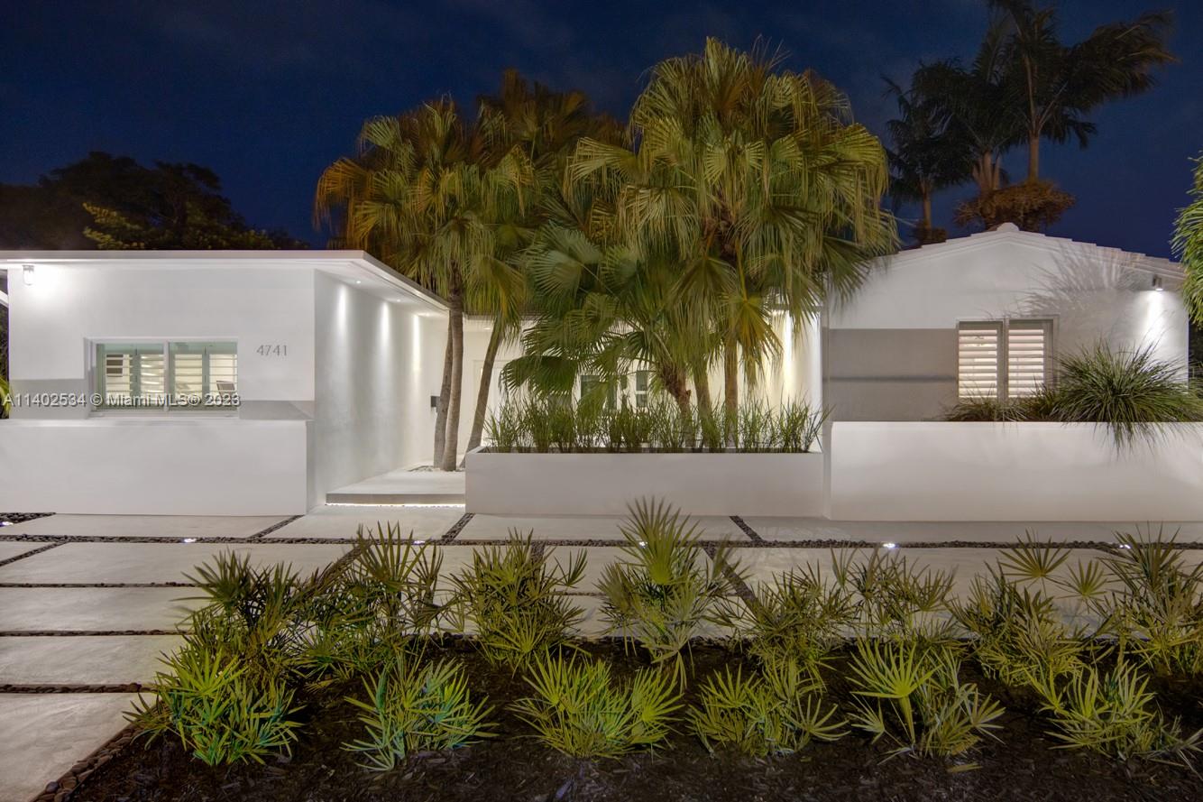 4741 Alton Road Miami Beach, FL 33140 - Photo 23 of 27 a view of a house with a yard