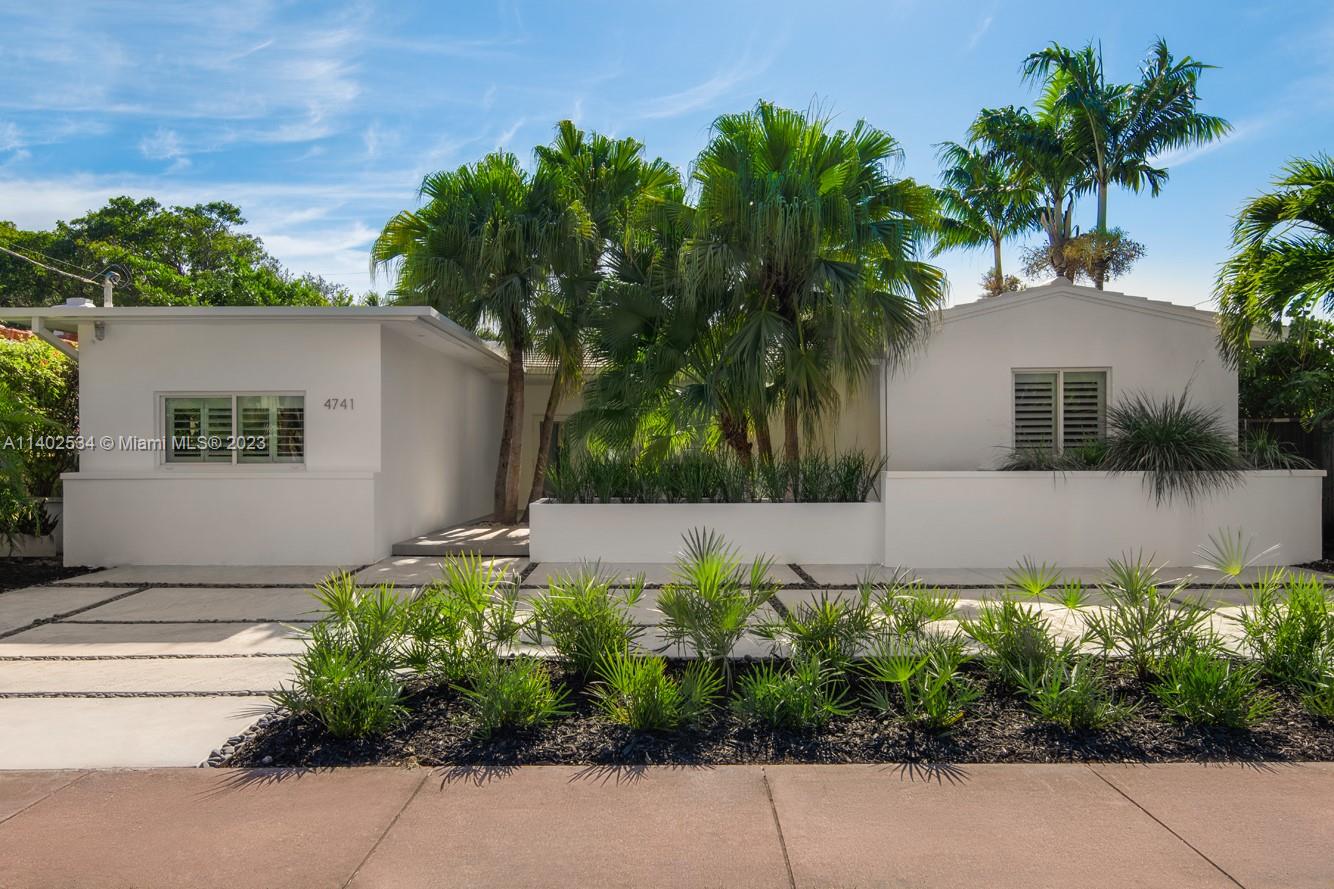 4741 Alton Road Miami Beach, FL 33140 - Photo 25 of 27 a front view of a house with a yard