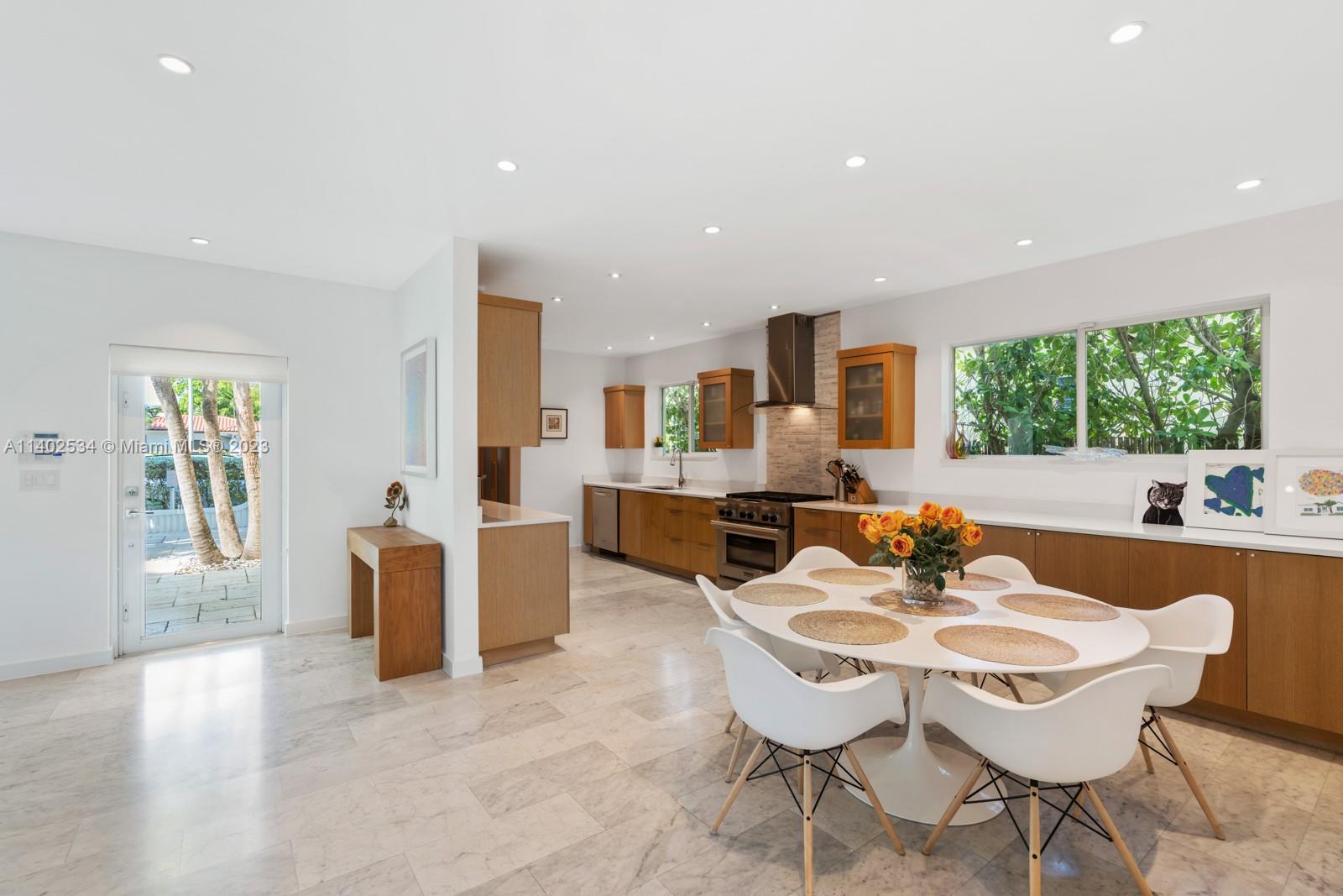4741 Alton Road Miami Beach, FL 33140 - Photo 3 of 27 a view of a dining room with furniture and window