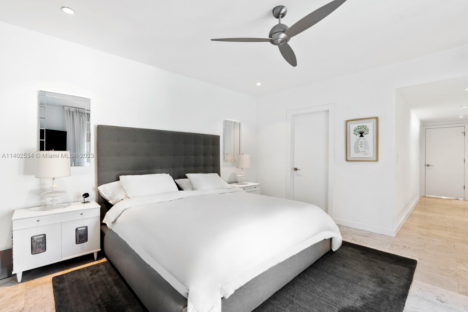 4741 Alton Road Miami Beach, FL 33140 - Photo 7 of 27 a bedroom with a bed and a flat screen tv