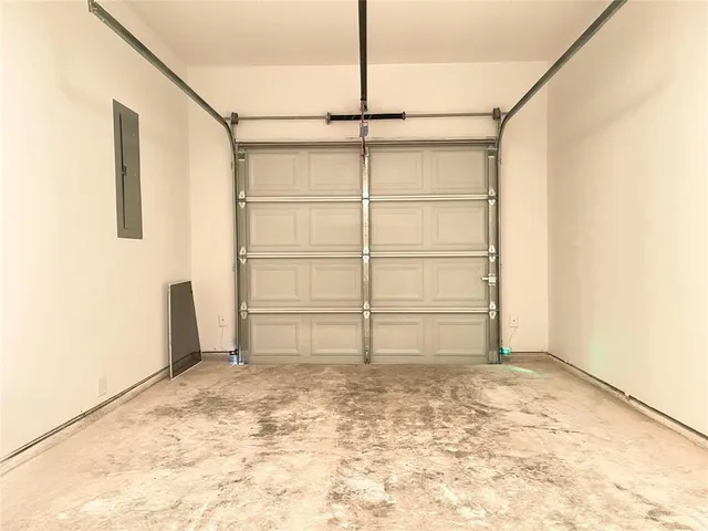 a front view of a house with a garage