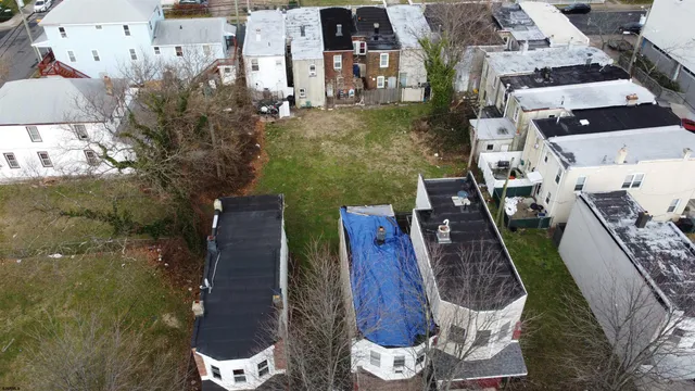 an aerial view of a house with outdoor space