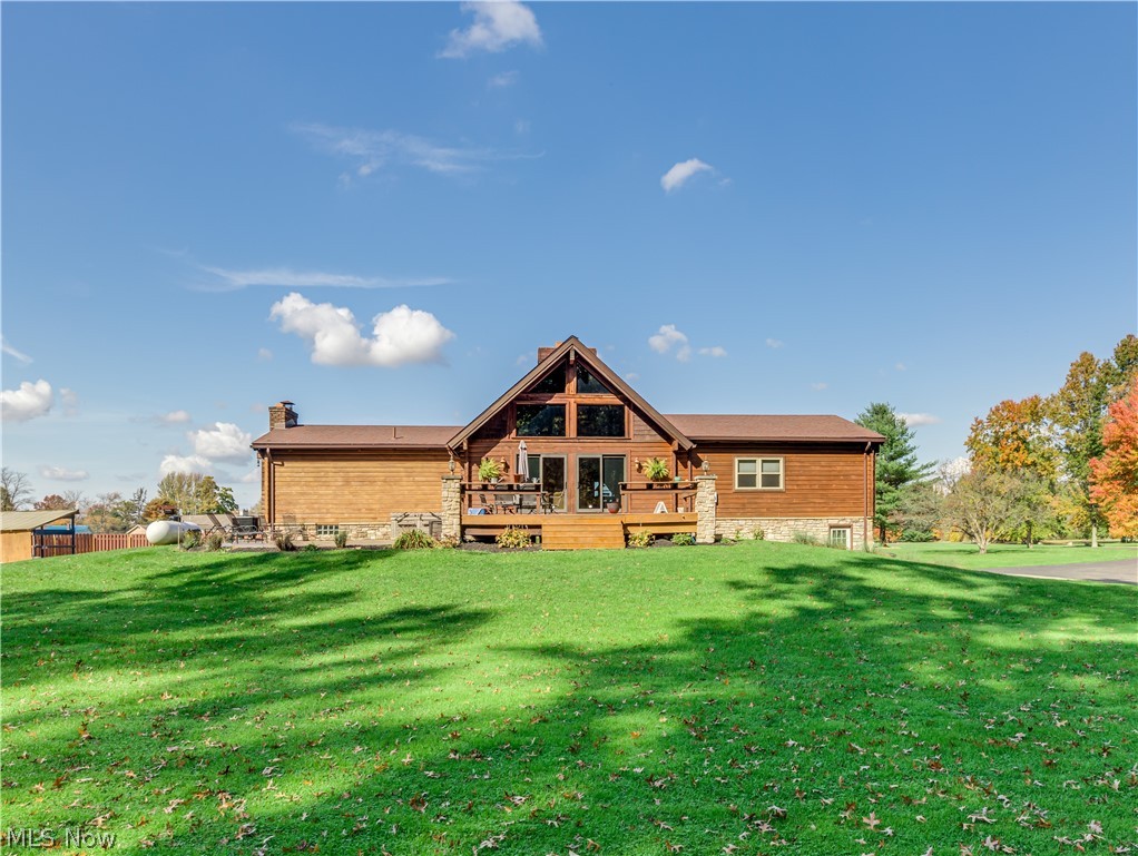 11520 Lair Road Northeast Alliance, OH 44601 - Photo 5 of 33 This gorgeous home offers beautiful log cabin wood construction floors, walls, and ceilings throughout.
