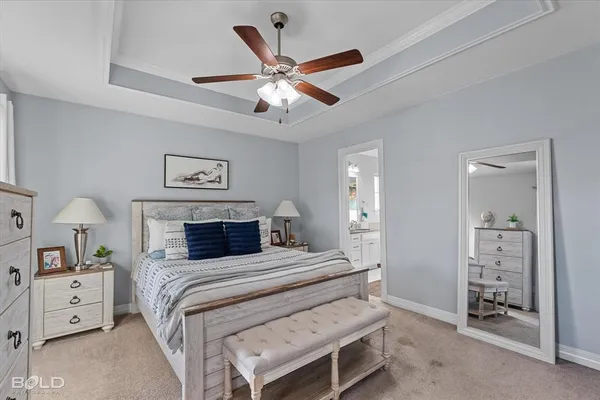 a bathroom with a granite countertop double vanity sink and mirror