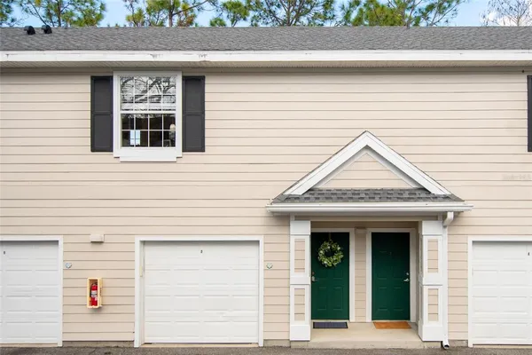 a view of a house with door and wooden floor