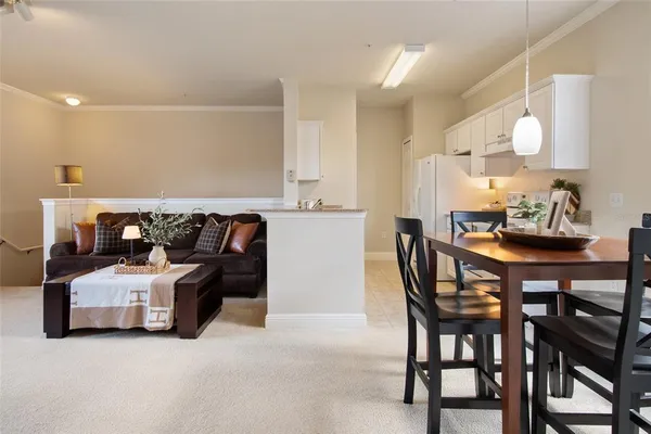 a living room with a couch and a table with wooden floor