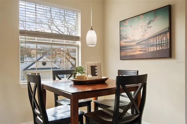 a dining room with furniture and window