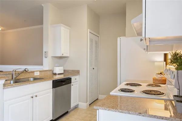 a kitchen with a stove and a sink
