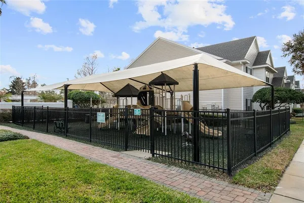 a view of a dinning tables and chairs under an umbrella