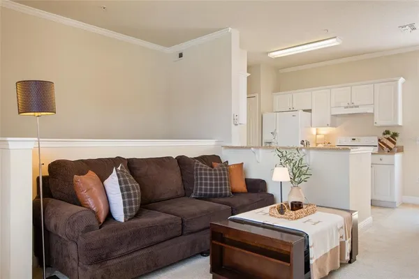 a living room with furniture and white walls