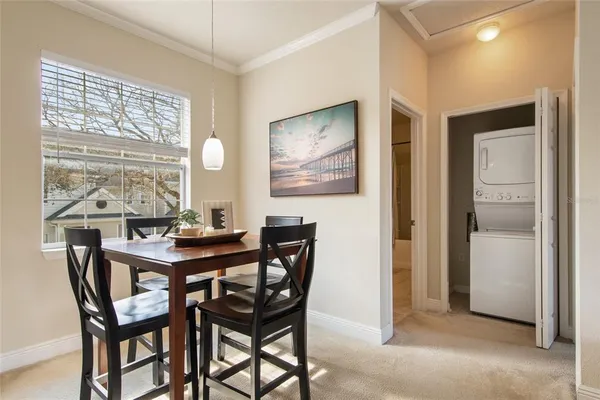 a view of a dining room that has a table and chairs