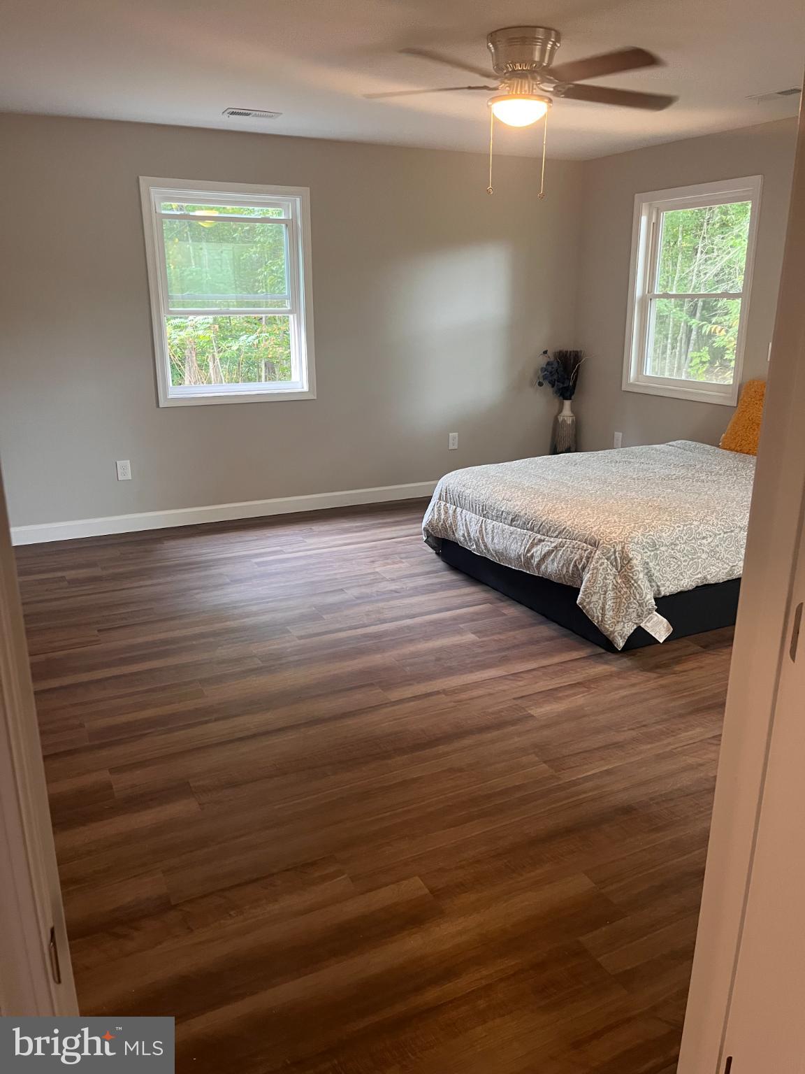 28542 Raccoon Ford Road Burr Hill, VA 22433 - Photo 11 of 31 a spacious bedroom with a bed and a window