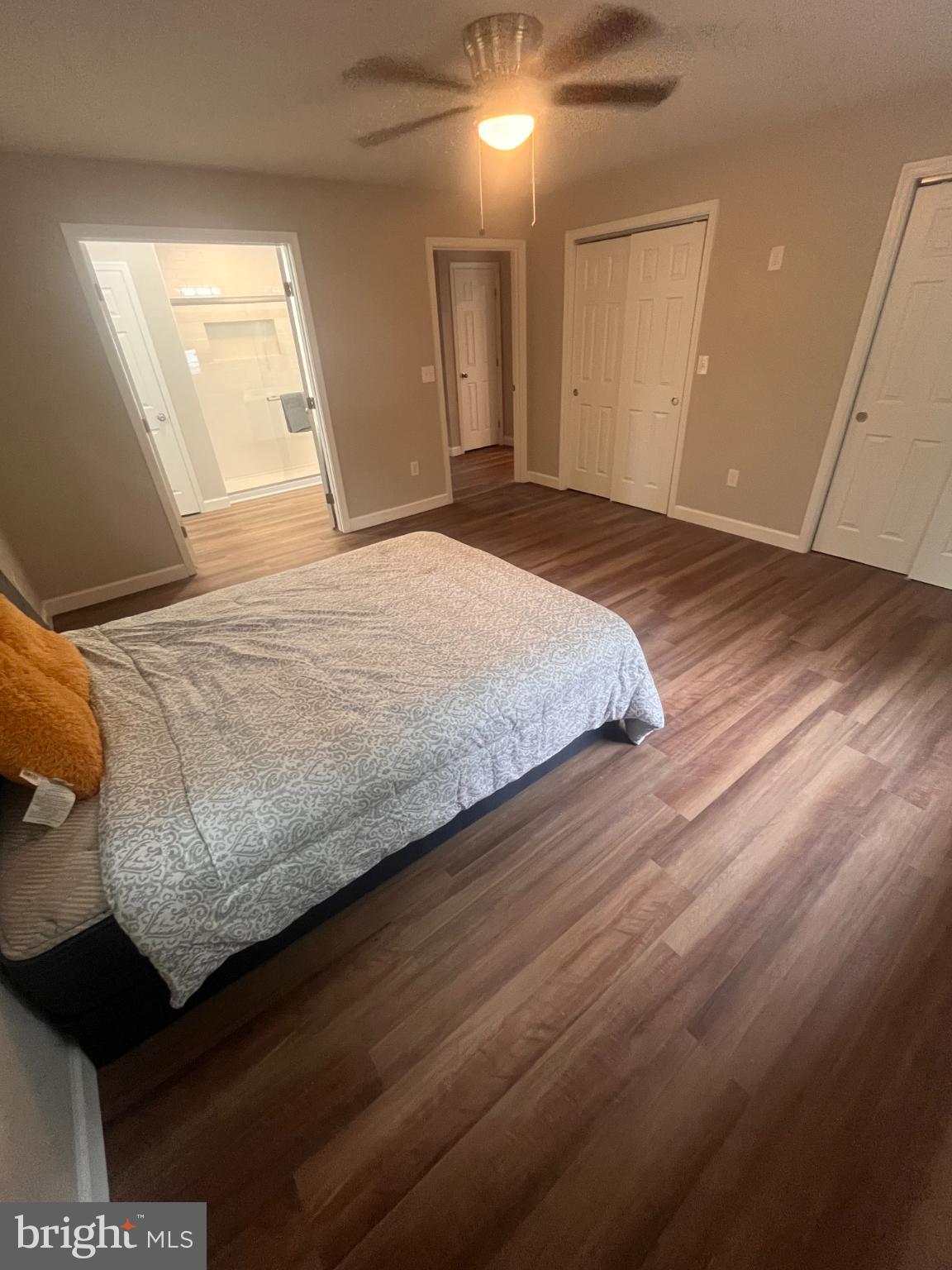 28542 Raccoon Ford Road Burr Hill, VA 22433 - Photo 13 of 31 a bedroom with a bed and wooden floor