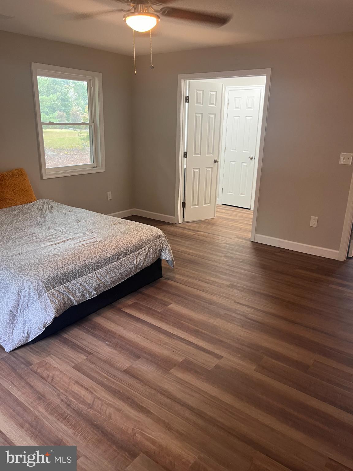 28542 Raccoon Ford Road Burr Hill, VA 22433 - Photo 14 of 31 a bedroom with a bed and a window