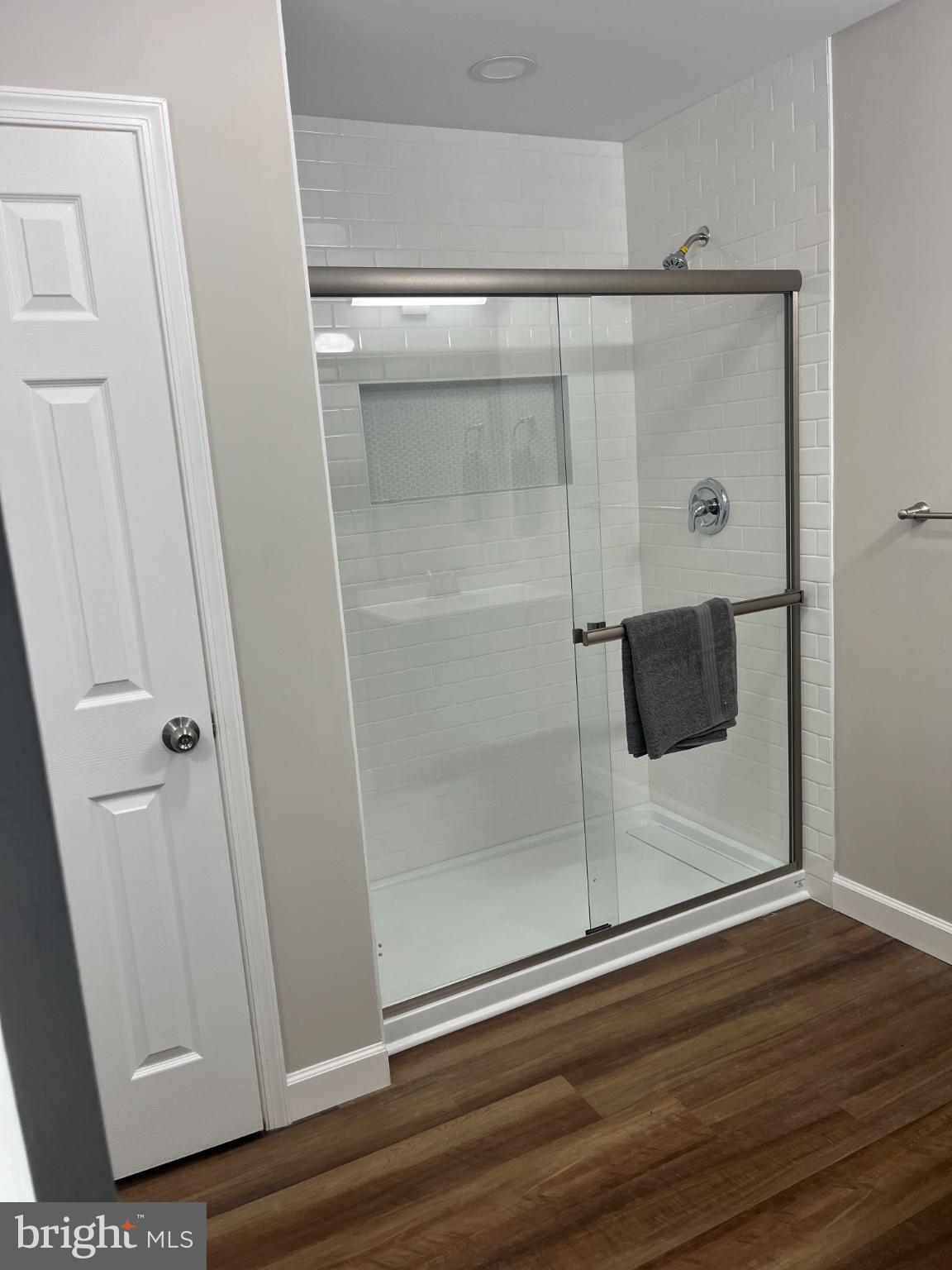 28542 Raccoon Ford Road Burr Hill, VA 22433 - Photo 15 of 31 a bathroom with a glass shower door